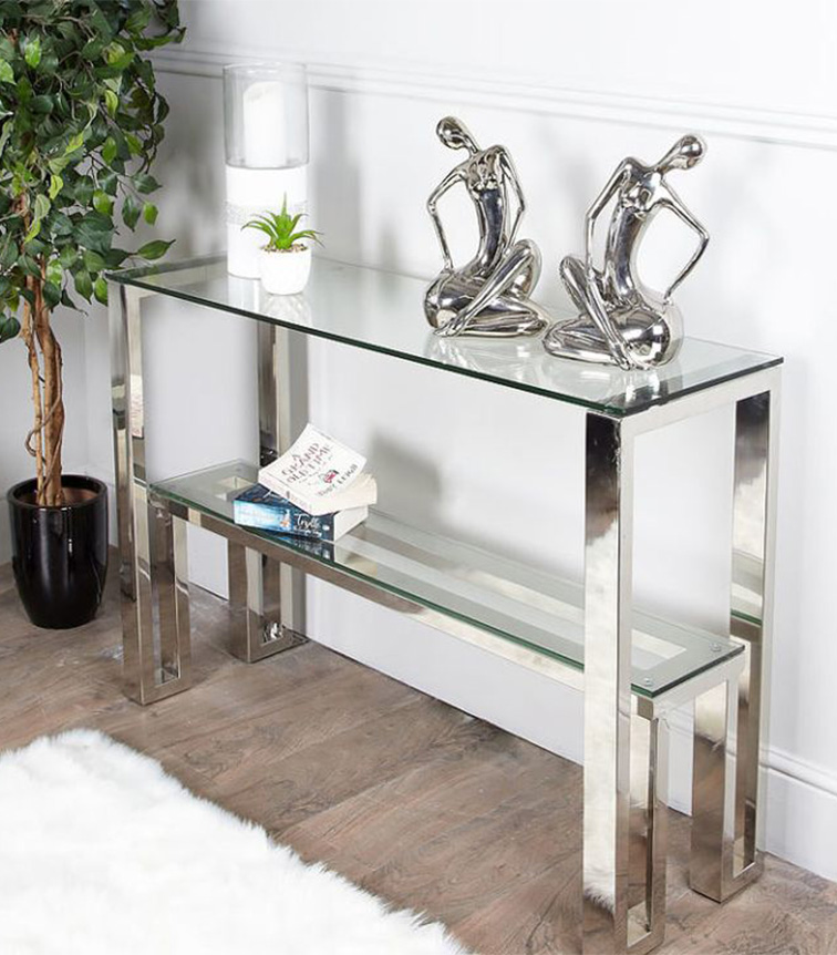 table made up of stainless steel pipe for decorative purposes contained show pieces and books
