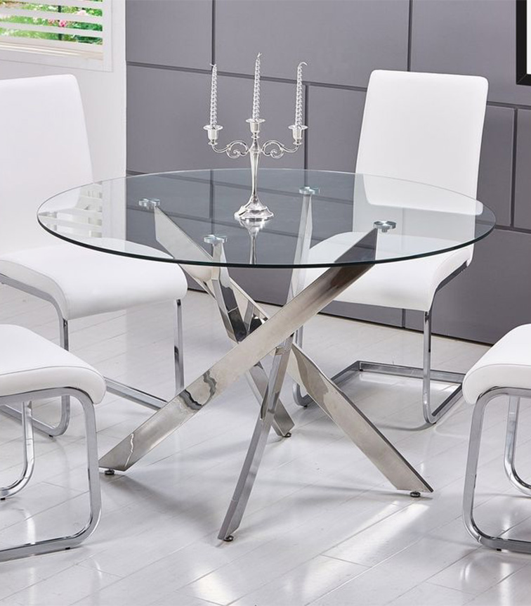 chairs and a round table with a candle stand made up of stainless steel