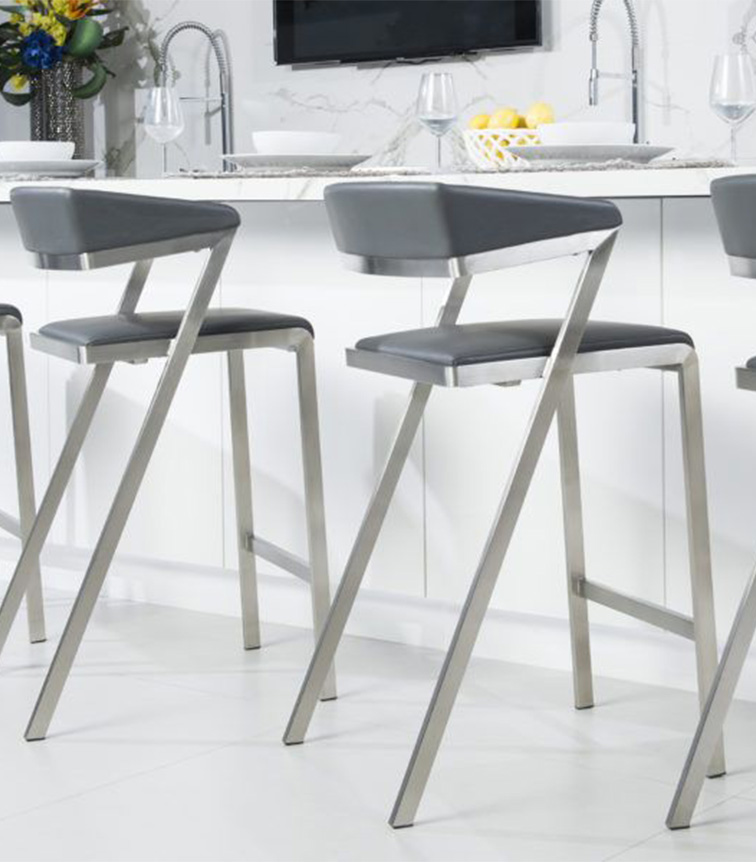 Bar chairs made of stainless steel pipe in a kitchen with white interior