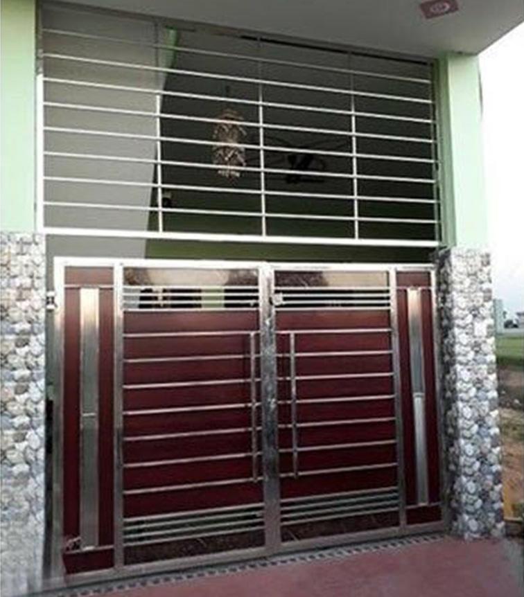 Grill over the gate and main gate of a house is made of stainless steel pipe